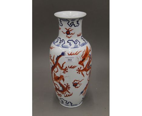 A Chinese porcelain vase decorated with five clawed dragons chasing flaming pearls, the underside with square seal mark and d