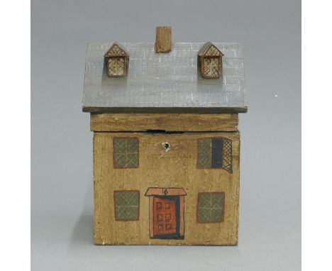 A tea caddy formed as a house. 20.5 cm high.