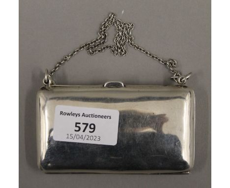 A silver purse. 9.5 cm wide.