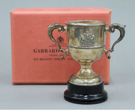 A small boxed Garrard &amp; Co silver trophy cup. 9 cm high. 173.1 grammes.