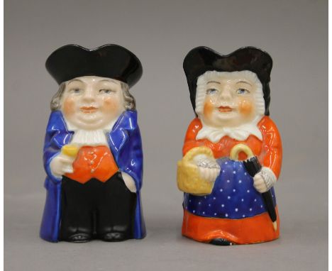 Two small Royal Worcester toby jugs. The largest 9 cm high.