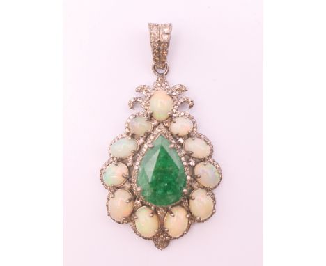 A silver opal, emerald and diamond set pendant.  5 cm high including suspension loop. 