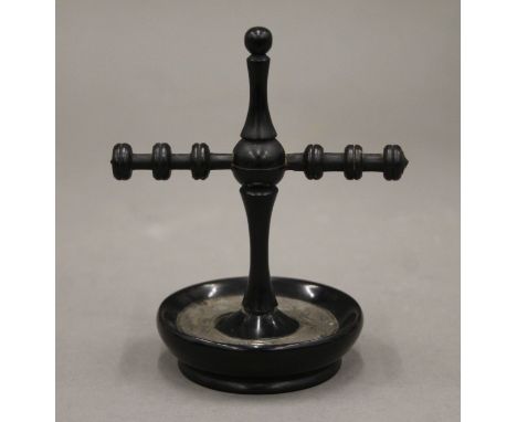 An ebony and silver ring tree, hallmarked London 1922. 11 cm high.