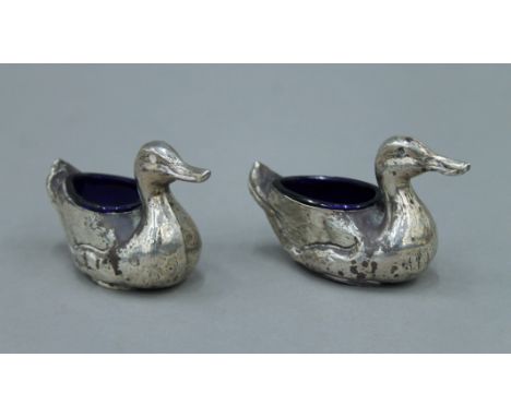 A pair of duck form silver salts. 10 cm long.