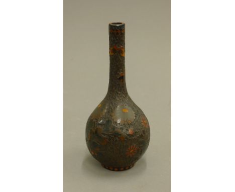 An enamel decorated Japanese vase and another vase. The former 18 cm high.