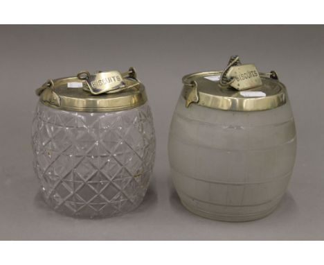 Two silver plated mounted glass biscuit barrels. The largest 18 cm high.