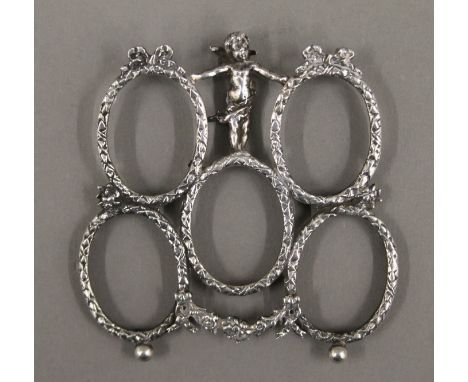 An unusual five section silver photograph frame, with imports for Chester 1900. 9 cm high.