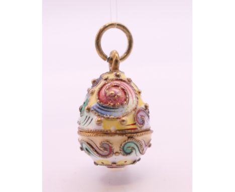 A Russian silver enamel egg pendant.  2 cm high.