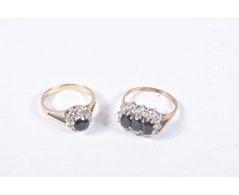 TWO 9CT GOLD SAPPHIRE DRESS RINGS, the first designed as a circular sapphire within a single cut diamond surround to the bifu