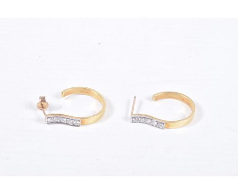 A PAIR OF YELLOW METAL AND DIAMOND HOOP EARRINGS, five round brilliant cut diamonds, grain set in white metal, approximate to