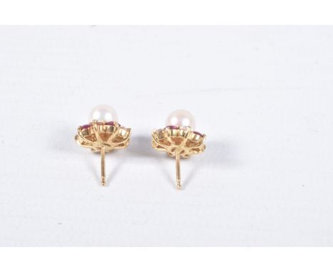 A PAIR OF YELLOW METAL CULTURED PEARL AND GEM SET EARRINGS, each set with a single cultured pearl, in a surround of red spine