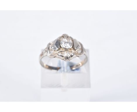 A SINGLE STONE DIAMOND RING, designed as a central old cut diamond within a pierced geometric style surround, estimated diamo