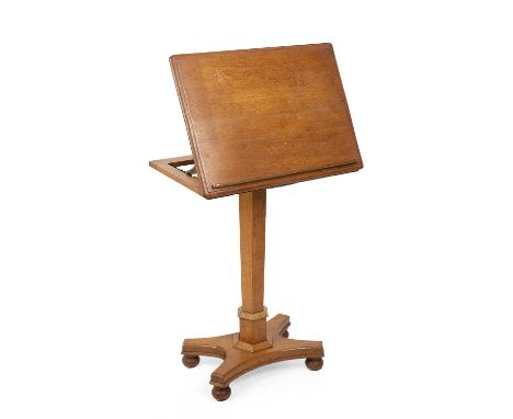 A Victorian light oak reading table with an adjustable top and hexagonal stem 58cm wide 43cm deep 76cm high