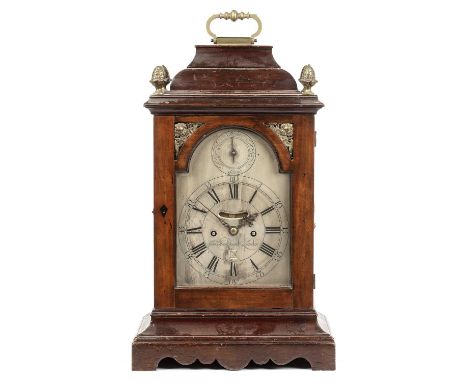 An 18th century bracket or table clock, the break arch silvered Roman dial with Arabic five minutes, false pendulum aperture,