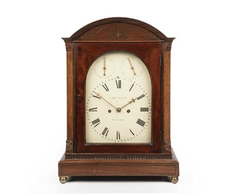 A 19th century mahogany table clock, the white painted arched Roman dial signed James McCabe, Royal Exchange, London, with su