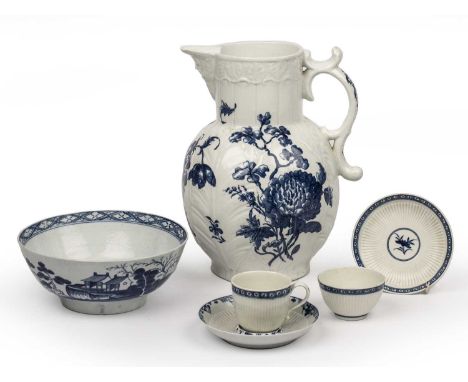 A large 18th century Worcester blue and white jug 27cm high, two 18th century Worcester tea cups and saucers and an 18th cent