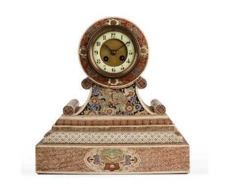 A Japanese Satsuma porcelain cased mantle clock with an enamelled dial, 34cm widen 19cm deep 35cm high.Crazing, two chips to 