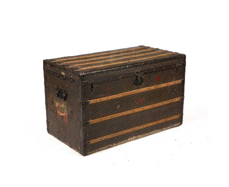 An early 20th century E Goyard Aine Travelling Trunk with chevron decoration, wooden slats and carrying handles, the lifting 
