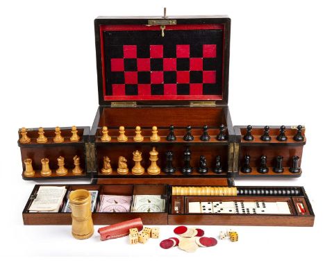 A late Victorian walnut cased games compendium by the Royal Cabinet of Games the fitted interior with boxwood and ebony chess