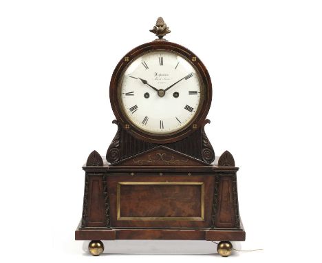 A Regency mahogany Egyptian revival table clock, the white enamel Roman dial signed Leplastrier, Mark Lane, London. The twin 