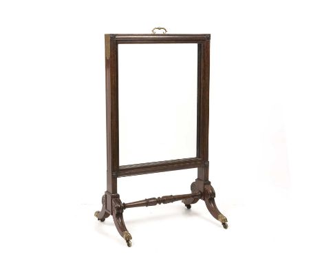 A Georgian mahogany fire screen with sliding glass panels 62cm wide 112cm high.