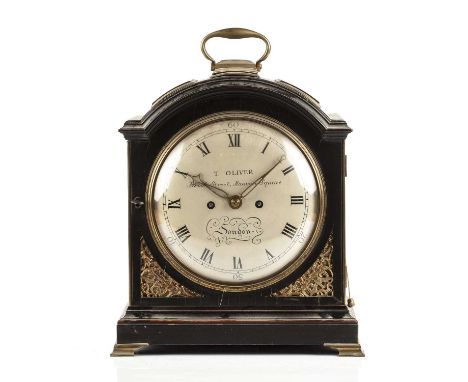 A George III ebonised bracket or table clock, the painted convex Roman dial with Arabic ten minutes signed T Oliver, Brook St