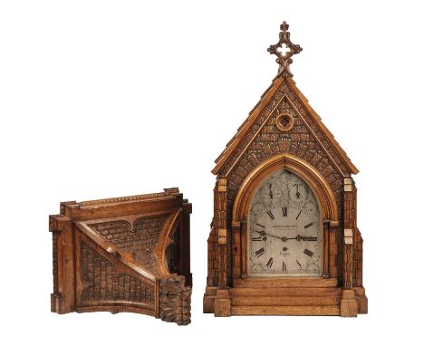 A Victorian Carved oak Gothic revival bracket clock by Wassell and Halford London 1875. The substantial six columnar pillar t
