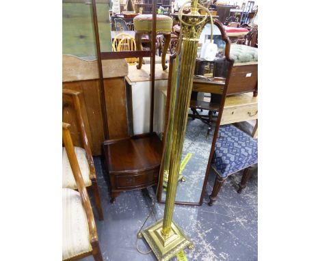 A MAHOGANY CHEVAL MIRROR, TOGETHER WITH A BRASS STANDARD LAMP.