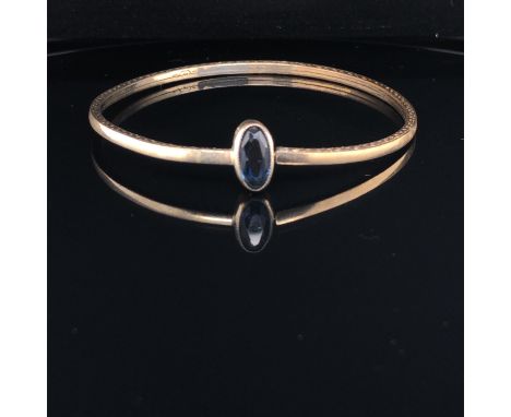 A CHILDS VINTAGE STONE SET BANGLE, INDISTINCTLY SIGNED POSSIBLY SP.