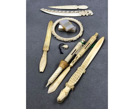 A SMALL QUANTITY OF IVORY AND BONE OBJECTS TO INCLUDE A STANHOPE CRYSTAL PALACE, LETTER OPENERS, A CARVED BANGLE, ETC. 