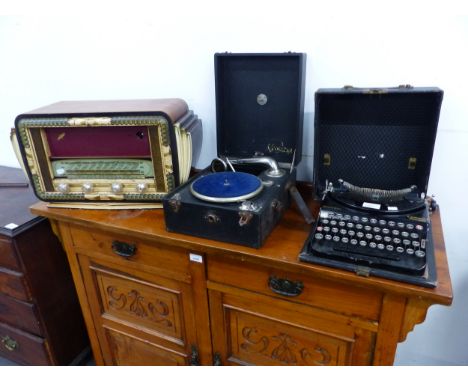 A VINTAGE REMINGTON COMPACT PORTABLE TYPEWRITER, A PORTABLE GRAMOPHONE, AND A A 1950'S VALVE RADIO. 