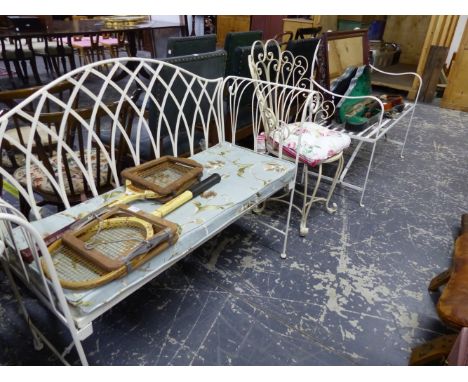 A WROUGHT IRON REGENCY STYLE GARDEN SEAT, ANOTHER GARDEN BENCH WITH A SQUAB CUSHION, AND A DECORATIVE IRON CHAIR. 