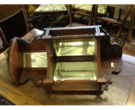 A mirror back oak corner shelf.