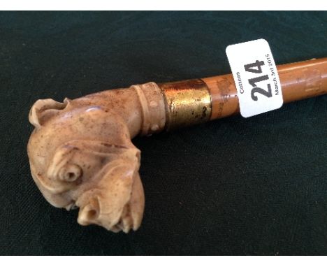 A malacca cane walking stick with faux bone dogs' head handle.
