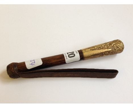A small 18 carat gold plate mounted leather ladies' whip.