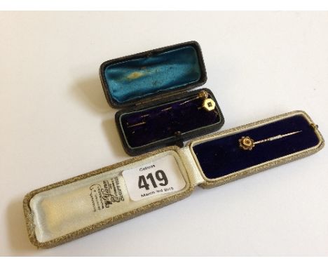 Three various 9 carat gold stick pins.