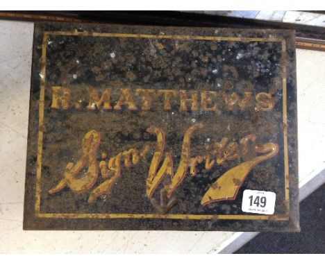 An early 20th century sign writers metal paint box, inscribed R Matthews Signwriter (with impressed military arrow to front).