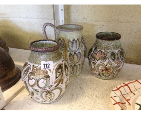A pair of Bourne Denby vases by Glynn Colledge decorated in an abstract floral pattern together with a similar single handle 