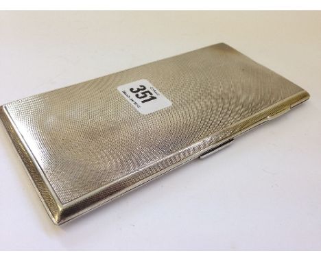 A heavy rectangular engine turned silver cigarette case by Leighton, Burlington Arcade, London (295 grams).