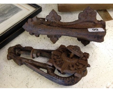 A 19th Century Kenrick cast iron door knocker together with another.