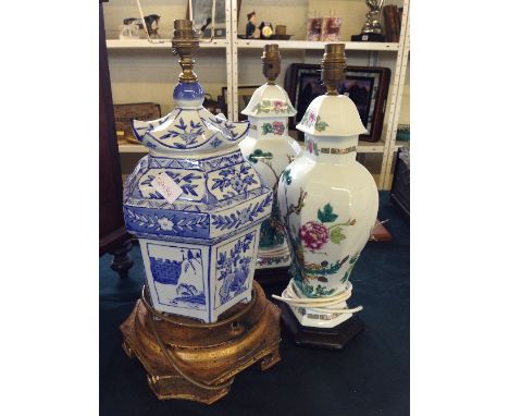 A pair of Limoges porcelain Chinese style urn shaped lamp bases, decorated with birds and exotic foliage together with a mode