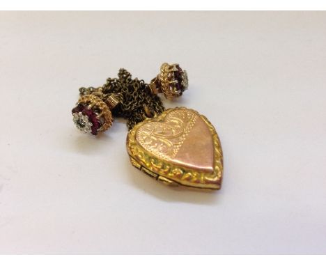 A 9 carat back and front gold locket together with a pair of 9 carat ruby and diamond set earrings.