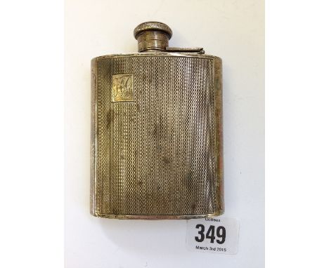An early 20th century engine turned silver hip flask (160 grams).