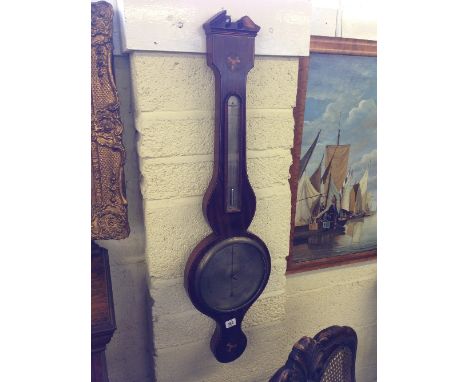 A 19th century mahogany inlaid wheel barometer by G Scott, Oxford (examine).
(R31)