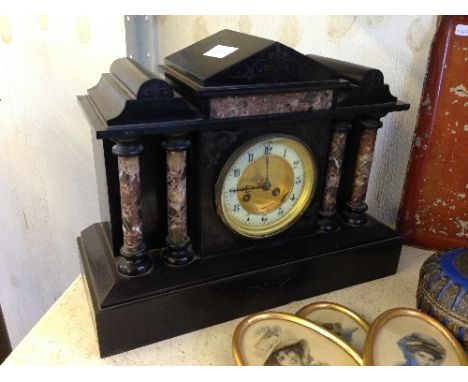 A late 19th century marble and slate cased architectural mantle clock.