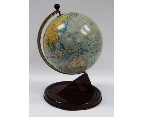 A CHAD VALLEY TINPLATE TERRESTIAL GLOBE, the faux-wood stand with printed detail, 28cms high, circa 1950s BBC Bargain Hunt 