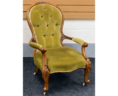 QUEEN ANNE STYLE BUTTON-BACKED ARMCHAIR with foliate carving to top, 90 x 57 cms