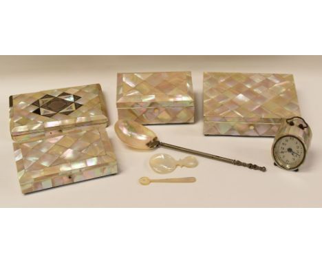 A COLLECTION OF MOTHER-OF-PEARL DOMESTIC ITEMS comprising a needlework case with contents, a bedroom-clock, three boxes with 