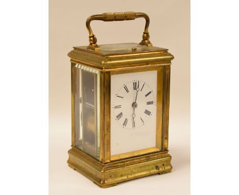 EARLY TWENTIETH CENTURY BRASS CASED ANGLO-FRENCH CARRIAGE CLOCK with eight day repeating movement striking on a gong, the whi