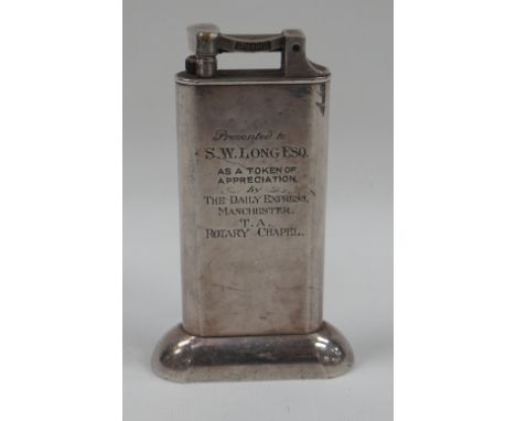 WHITE METAL TABLE-LIGHTER BY DUNHILLL engraved with the following 'Presented to S.W LOG ESQ AS A TOKEN OF APPRECIATION by THE